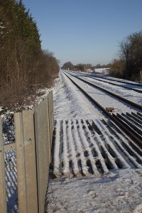Railway line from crossing in the snow